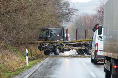 BOSZENFA, HUNGARY - JANUARY 10 2023: Fallen tree blocked the road and   caused congestion on the road Boszenfa. January 10 2023 Boszenfa, Hungary-stock-photo