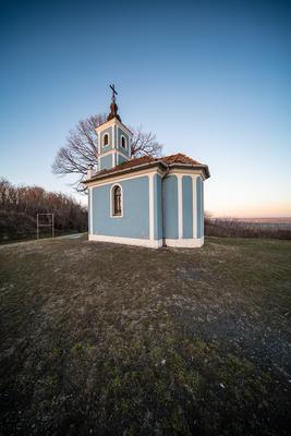 Small chapel with huge tree, called in Hungary Mausz Kapolna-stock-photo