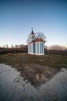 Small chapel with huge tree, called in Hungary Mausz Kapolna-stock-photo