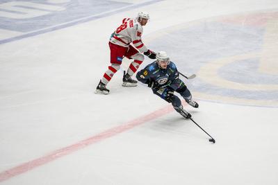 BUDAPEST - FEBRUARY 2: MAC Budapest (Budapest Jégkorong Akadémia Hockey Club) (blue) and Gyergyoi HK  (white) ice hockey teams participate in Championship, February 2, 2024 in Budapest, Hungary.-stock-photo