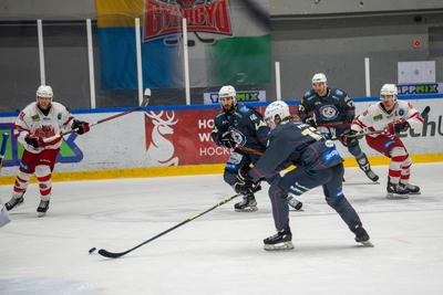 BUDAPEST - FEBRUARY 2: MAC Budapest (Budapest Jégkorong Akadémia Hockey Club) (blue) and Gyergyoi HK  (white) ice hockey teams participate in Championship, February 2, 2024 in Budapest, Hungary.-stock-photo