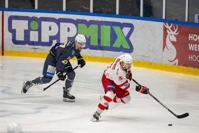 BUDAPEST - FEBRUARY 2: MAC Budapest (Budapest Jégkorong Akadémia Hockey Club) (blue) and Gyergyoi HK  (white) ice hockey teams participate in Championship, February 2, 2024 in Budapest, Hungary.-stock-photo