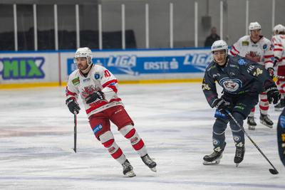 BUDAPEST - FEBRUARY 2: MAC Budapest (Budapest Jégkorong Akadémia Hockey Club) (blue) and Gyergyoi HK  (white) ice hockey teams participate in Championship, February 2, 2024 in Budapest, Hungary.-stock-photo