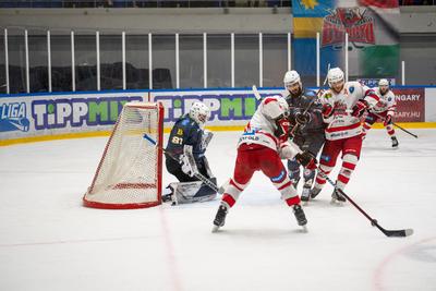 BUDAPEST - FEBRUARY 2: MAC Budapest (Budapest Jégkorong Akadémia Hockey Club) (blue) and Gyergyoi HK  (white) ice hockey teams participate in Championship, February 2, 2024 in Budapest, Hungary.-stock-photo