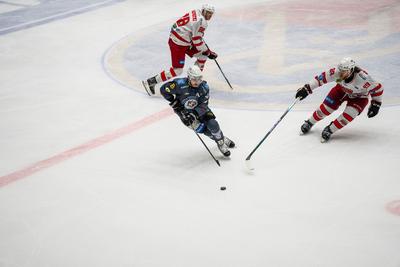 BUDAPEST - FEBRUARY 2: MAC Budapest (Budapest Jégkorong Akadémia Hockey Club) (blue) and Gyergyoi HK  (white) ice hockey teams participate in Championship, February 2, 2024 in Budapest, Hungary.-stock-photo