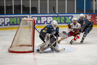 BUDAPEST - FEBRUARY 2: MAC Budapest (Budapest Jégkorong Akadémia Hockey Club) (blue) and Gyergyoi HK  (white) ice hockey teams participate in Championship, February 2, 2024 in Budapest, Hungary.-stock-photo