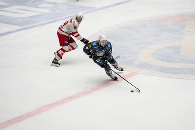 BUDAPEST - FEBRUARY 2: MAC Budapest (Budapest Jégkorong Akadémia Hockey Club) (blue) and Gyergyoi HK  (white) ice hockey teams participate in Championship, February 2, 2024 in Budapest, Hungary.-stock-photo