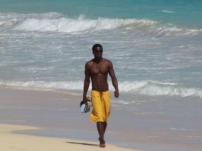 Cape Verde - African man walking on the Beach-stock-photo