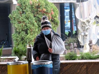 Woman in Coronavirus Mask with broken arm - Budapest-stock-photo