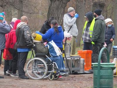 Woman in wheelchair waiting for food distribution - Hungary-stock-photo