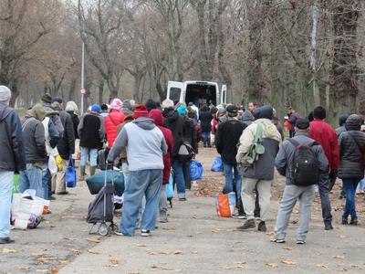 Homeless people waiting for food distribution - Budapest-stock-photo