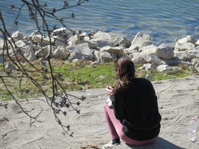Lonely girl - Spring - Danube river-stock-photo