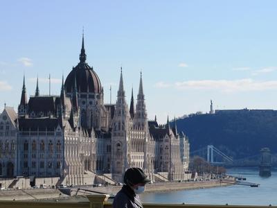 Budapest view - Woman crossing Margaret bridge - Parliament - Danube - Gellért Hill-stock-photo