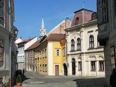 Sopron - Hungary - Szent György street and Church-stock-foto