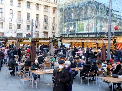 Snacking tourists - Winter Fair - Budapest-stock-photo