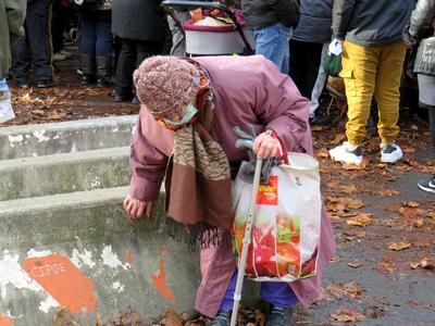 An elderly aunt waiting for Christmas food distribution -  Budapest-stock-photo