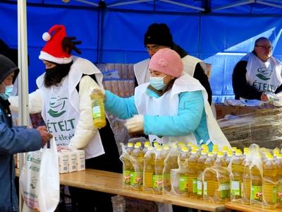Christmas food distribution in Népliget - Cooking oil to the needy.-stock-photo