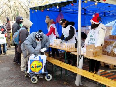 Christmas food distribution - Man puting flour into the bag - Budapest-stock-photo