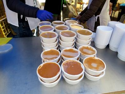 Hot soup for Christmas in the poor kitchen - Food distribution - Budapest-stock-photo