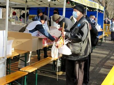 Blind man waiting for Food - Poor kitchen - Christmas - Budapest-stock-photo