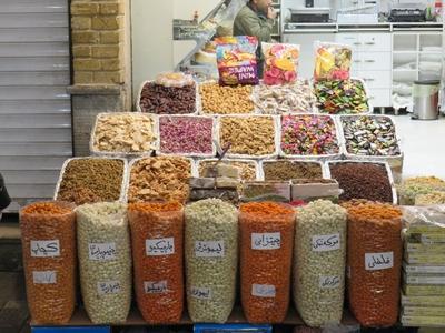 Seeds, dried fruits and vegetables on a counter in Tehran's Grand Bazaar-stock-photo