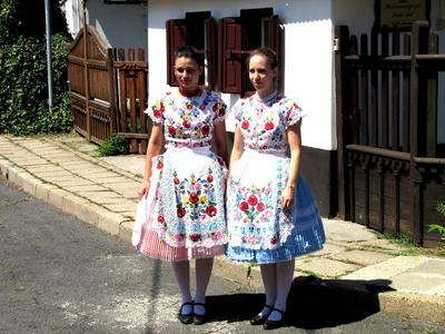 Girls dressed in embroidered folk costumes in Mezőkövesd -Hungary-stock-photo