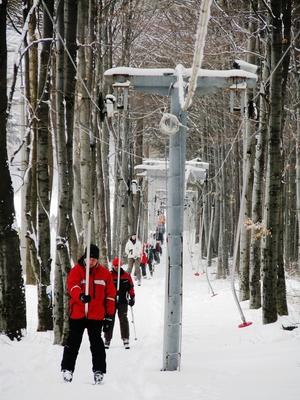 Skiers by lift at the Kékestető ski slope - Hungary-stock-photo