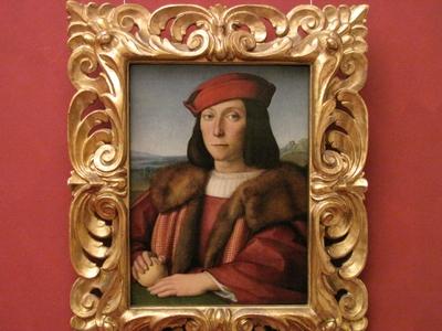 Young Man with an Apple - Raffaello - Florence - Uffizi-stock-foto