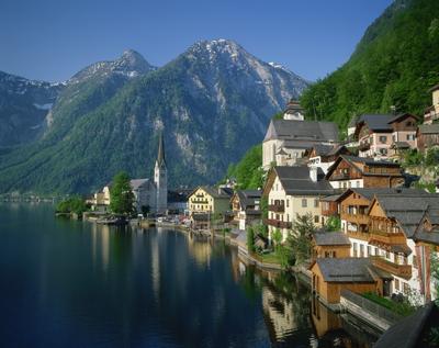 Houses, chalets and the church of the village of Hallstatt beside the lake, in morning light, UNESCO World Heritage Site, near Salzburg in the Salzkammergut, Austria, Europe-stock-photo