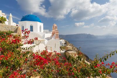 View of blue domed church and sea in Oia village, Santorini, Aegean Island, Cyclades Island, Greek Islands, Greece, Europe-stock-photo