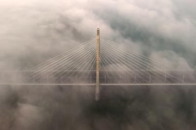 Foggy sunrise at Megyeri bridge. The Megyeri bridge is located on the northern border of budapest. A part of M0 ring road.Drive carefuly when the weather is misty.-stock-photo
