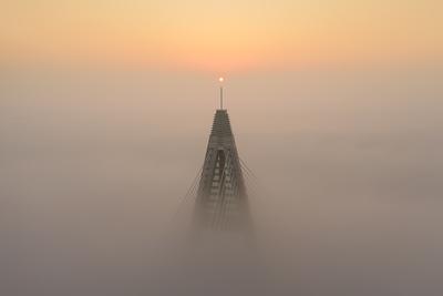 Foggy sunrise at Megyeri bridge. The Megyeri bridge is located on the northern border of budapest. A part of M0 ring road.Drive carefuly when the weather is misty.-stock-photo