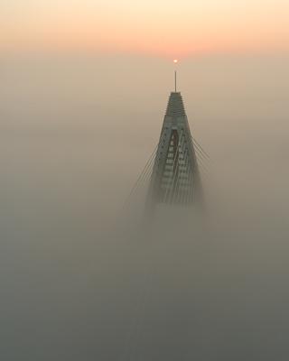 Foggy sunrise at Megyeri bridge. The Megyeri bridge is located on the northern border of budapest. A part of M0 ring road.Drive carefuly when the weather is misty.-stock-photo