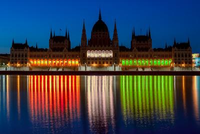 The Hungarian parliament luminous with the national colors.-stock-photo