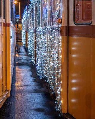 Festively decorated light tram (fenyvillamos) by night.-stock-photo