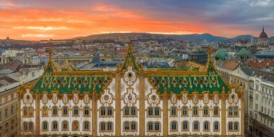 Amazing roof in Budapest, Hungary. State Treasury building with Hungarian Parliament in winter time.  All tiles on the roof made from the world famous Zsolnay pyro granite.-stock-photo