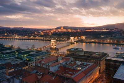 Sunset cityscape from Budapest with Danube river, Szechenyi chain bridge, Buda caslle, Varkert bazaar  and sandor palace.-stock-photo