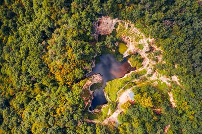 Flooded ancient stone quarry in Hungary near Sarospatak-stock-photo