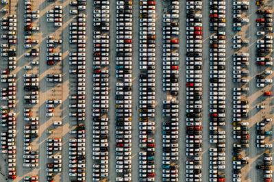 Aerial view new cars lined up in the parking station-stock-photo