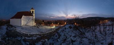 Winter panorama in Pécs, the county seat of Baranya. On the left side is Havihegy church, on the right side is the tv tower with floodlight.-stock-photo