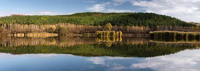 The reflection of an autumn day on the water of the lake-stock-photo