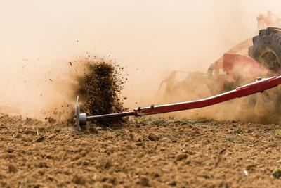 A farmer working on the field with a Horsch Pronto 4dc seeding drill.-stock-photo