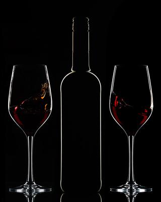 Red wine bottle and filled glasses-stock-photo