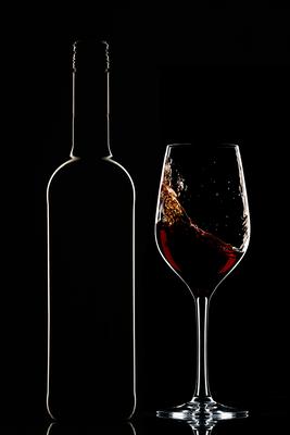 Red wine bottle and filled glass-stock-foto
