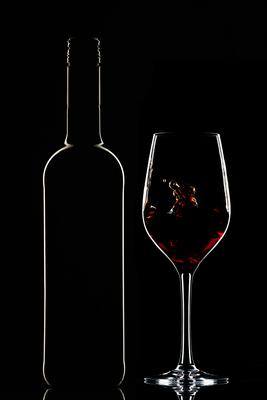 Red wine bottle and filled glass-stock-foto