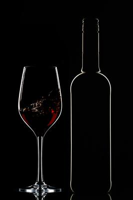 Red wine bottle and filled glass-stock-photo