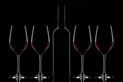 Red wine bottle and filled glass-stock-foto