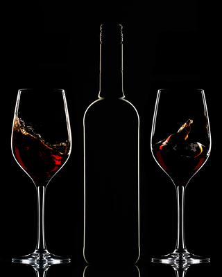 Red wine bottle and filled glass-stock-photo