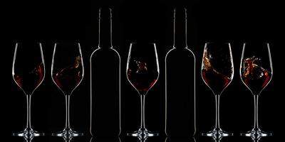 Red wine bottle and filled glass-stock-foto