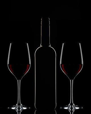 Red wine bottle and filled glass-stock-photo